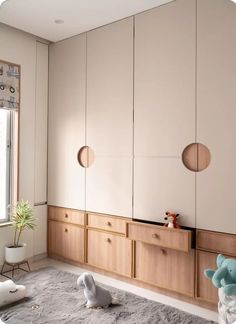 a bedroom with white walls and wooden furniture in the corner, along with an animal rug