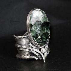 Modern, Brutalist-style Textured Ring. Fully handmade work. Oxidized 925 Sterling Silver and 999 Fine Silver. The main accent of this ring is a natural Seraphinite. Material: 925 Sterling Silver,999 Fine Silver, Seraphinite. The height of the central part is 3.7cm. Size: Adjustable. Color: Silver, Green. ► More at www.lunarieen.com (Prices 10% OFF) ◄ Luxury Collectible Brutalist Jewelry, Textured Ring, Oxidized Sterling Silver, Fine Silver, Statement Ring, Rings Statement, Sterling Silber, Artisan Jewelry, Statement Rings