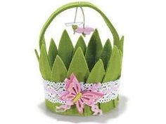 a paper basket with flowers and lace on it