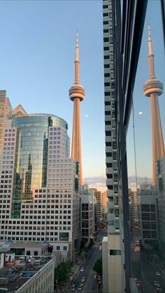 the view from an office building looking down at some tall buildings