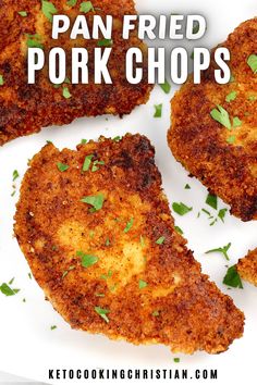 fried pork chops on a white plate with parsley sprinkled on top