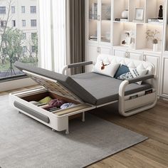 a bed that has been opened and is in the middle of a room