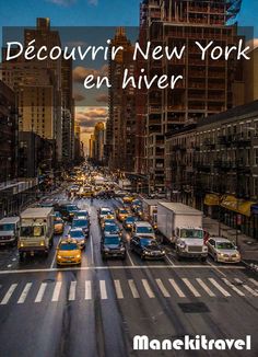 a city street filled with lots of traffic next to tall buildings in new york, ny