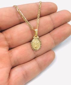 Cadena Y Dije del Divino Niño en Oro Laminado 14K Para Niños/Mujer 16x10mm 16". 14K Gold Filled Divino Niño Necklace 16” for Women or Kids, Baby Jesus Pendant 16x10mm.Material: 14K Gold FilledChain Length: 16" InchesChain Thickness: 2mmChain Type: Gucci LinkPendant Measurements: 16x11mmCadena Y Dije del Divino Niño en Oro Laminado 14K Para Mujer o Niños.Material: 14K Oro LaminadoLongitud de la Cadena: 16" pulgadasGrosor de la Cadena: 2mmTipo de la Cadena: Gucci LinkMedidas del Dije: 16x11mmPleas Gucci Necklace Gold, Childrens Jewelry, Baby Jesus, Gold Filled Chain, Chain Length, Gold Filled, Jewelry Necklace Pendant, Jewelry Watches, Gold Necklace