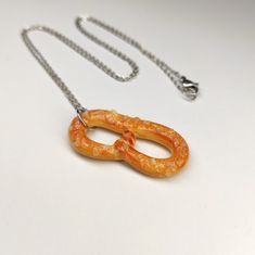 Pretzel Necklace Salty Pretzel Philly pretzel You can choose a necklace with one pretzel or three together. The length of the chain is 22 inches, but it can be changed according to your desire. Just write to me. Pretzel size: 1 5/8in x1 3/8in (40x35mm) Made of high quality polymer clay, exclusively hand made, without molds paint and varnish. All my creations are handcrafted by me with my full attention and care. Check out my other artworks at the store page: https://bijouxri.etsy.com Philly Pretzel, Pretzel Necklace, Write To Me, Slovenia, Pendant Necklaces, Jewelry Necklace Pendant, Polymer Clay, Oeuvre D'art, Jewelry Necklaces