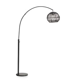 a black floor lamp with a wire ball shade