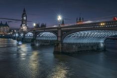 the big ben clock tower towering over the city of london, england at night time