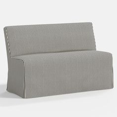 a black and white striped couch sitting on top of a floor