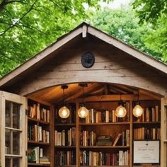 an outdoor library with lots of books on it's shelves and lights hanging from the ceiling