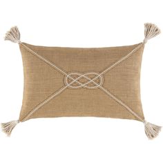 a tan pillow with tassels on the front and side, tied up in rope