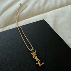 - This Is A Reworked Necklace! The Pendant Is True Ysl! - Selling Bc I Don’t Wear It - No Signs Of Stains Or Damage Yves Saint Laurent Necklace, Ysl Necklace Gold, Ysl Necklace, Necklace Designs, Womens Jewelry Necklace, Yves Saint Laurent, Saint Laurent, Gold Necklace, Jewelry Design