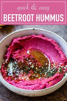 beetroot hummus in a white bowl with text overlay that reads quick and easy beetroot hummus