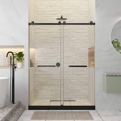 a bathroom with a white brick wall and glass shower door, black faucet