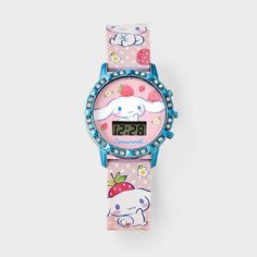 a pink watch with an elephant and strawberry on the face, sitting against a white background