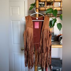 Amazon Sleeveless Vest With Fringe Size Large Brown/Camel Faux Suede Never Worn Sleeveless Brown Vest For Festivals, Brown Fringe Vest For Festival, Festival Fringe Brown Vest, Brown Sleeveless Fringe Vest, Sleeveless Vest, Faux Suede, Camel, Jackets & Coats, Jackets For Women