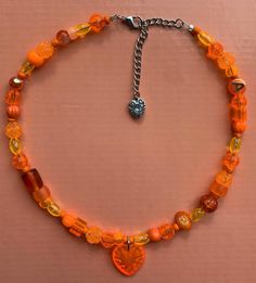 🍊 Orange Creamsicle 🎇 Made with glass beads, acrylic beads and silver components Orange Necklace Aesthetic, Clementine Aesthetic, Orange Necklaces, Orange Items, Orange Choker, Necklaces Pink, Orange Accessories, Orange Birthday, Orange Heart