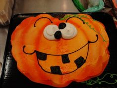 a cake decorated to look like a pumpkin