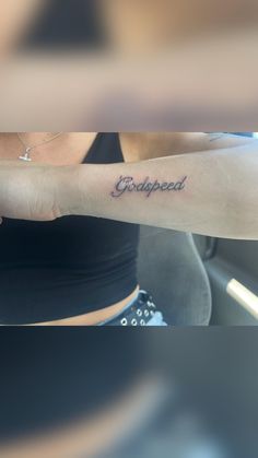 a woman with a tattoo on her arm that reads, choppedupped in cursive writing