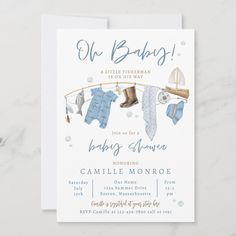 a baby shower card with clothes hanging on a line