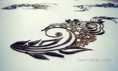 an intricately designed piece of art on white paper