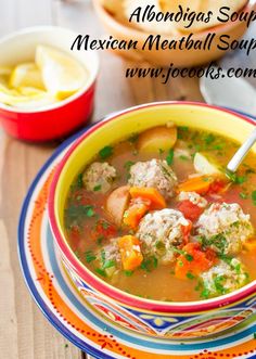 a bowl of mexican meatball soup on a plate