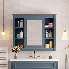 a bathroom vanity with blue cabinets and white counter top, along with a gold faucet