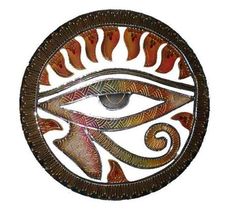 an eye is shown in the center of a circular metal wall art piece with flames coming out of it