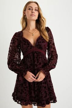 We already know your closet is full of beauties, but the Lulus Charming Favorite Burgundy Burnout Velvet Babydoll Mini Dress is definitely going to be one of your top picks! A velvet floral burnout design adorns a sheer mesh overlay (atop a matching knit liner) that shapes a lightly gathered bodice, a plunging, sweetheart-style neckline, and long sleeves with elasticized, ruffled cuffs. The high, empire waist tops a twirl-worthy skater skirt that falls to a ruffled mini hem. Delicate crochet lac Winter Wedding Guest Dress, Empire Waist Tops, Delicate Crochet, Babydoll Mini Dress, Burnout Velvet, Lulu Fashion, Shower Dresses, Grad Dresses, Mesh Overlay