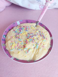 a cake with sprinkles and a toothbrush in it on a plate