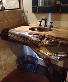 a bathroom with a sink made out of wood