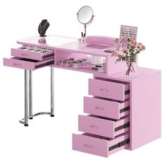 a pink desk with drawers and a mirror on the top is next to a flower vase