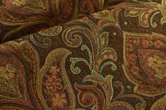 the fabric is brown and red with paisley patterns