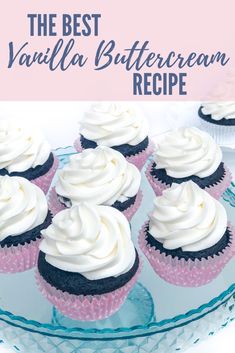 vanilla buttercream cupcakes with white frosting on a blue glass plate