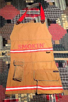 a fireman's apron with the word smokin on it