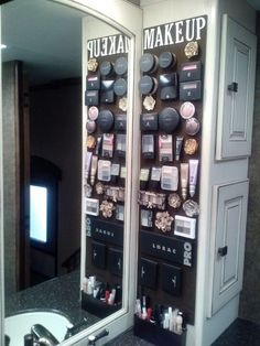 two mirrors with makeup products on them in a bathroom