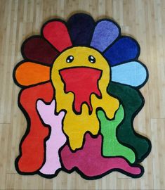 a colorful rug with an image of a turkey on it's face and hands