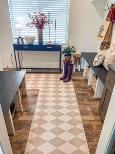 the hallway is clean and ready to be used as a storage area for shoes or other items