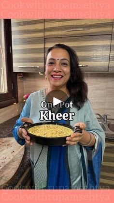 a woman holding a plate with food on it and the words one pot kheer