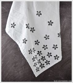 a white towel with black flowers on it