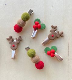 christmas decorations made out of felt and wooden pegs