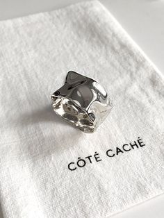 Silver Wave ring, by Côté Caché. This ring shines as though it were water, ebbing and flowing with liquid light.    ✦ Material : Sterling Silver ✦ Dimensions : T12.6mm ✦ Gift box included. ✦ Free UK Postage on orders over £49. ✦ International postage available. Reveal your hidden side, with Côté Caché. ~ Every Côté Caché piece is exclusively designed, combining symbolic aesthetics with innovative craftsmanship to create pieces that are as unique and beautiful as you are. Follow us for the latest Chunky Silver Jewellery, Mens Silver Ring, Liquid Light, Chunky Silver Rings, Chunky Ring, Wave Ring, Chunky Rings, Mens Silver Rings, Unique Ring