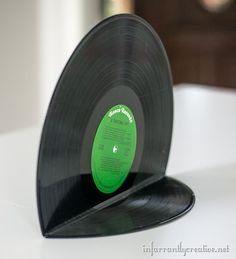 an old vinyl record sitting on top of a table