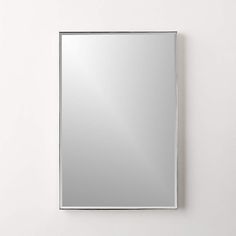 a mirror mounted to the side of a wall