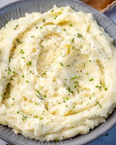 mashed potatoes in a bowl with herbs on top and the title overlay reads healthy mashed potatoes