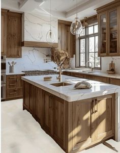 a large kitchen with marble counter tops and wooden cabinetry, along with an island in the middle