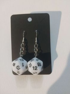 Earrings with 20 sided dice attached. Dice Outfits Inspired, D20 Earrings, Dice Bracelet, 20 Sided Dice Earrings, Dice Jewelry, Dice Earrings, 20 Sided Dice, Desired Reality, Jewelry Earrings Dangle