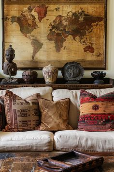 a living room filled with lots of furniture and pillows on top of a white couch