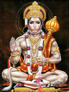 the monkey god is sitting in front of an open book and holding his hands up