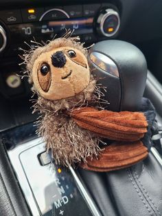 a stuffed animal is sitting in the car