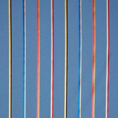 a blue background with multicolored ribbons on it